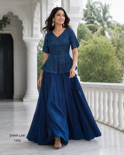 Georgette Sequins Embroidered Peplum Top with Shimmer Organza Lehenga.